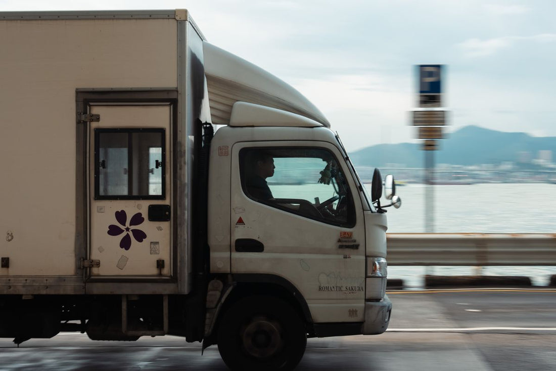 Moving truck traveling on an open road