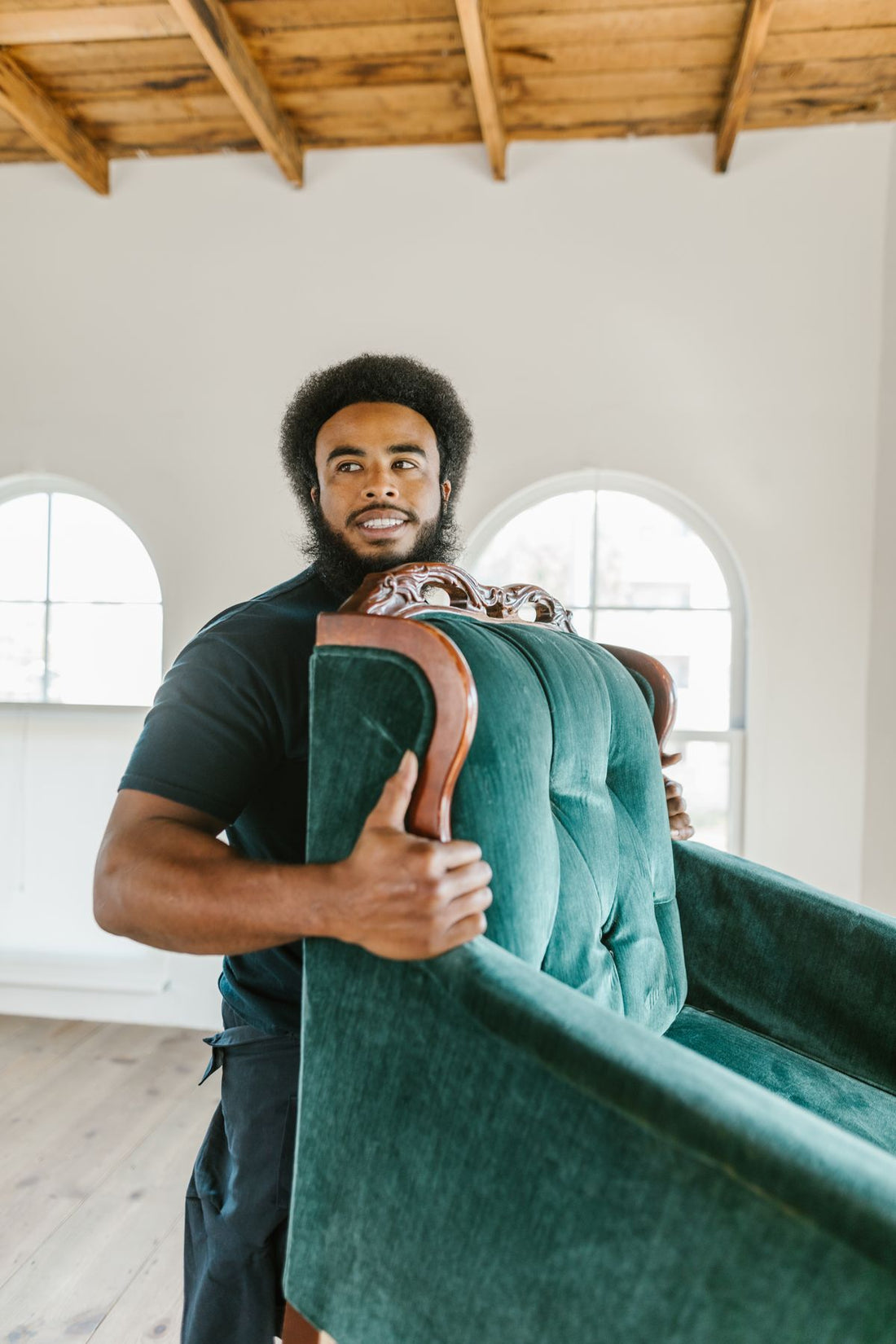 Mover lifting an armchair during a move